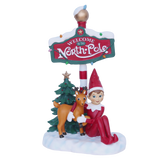 Elf Sitting with Reindeer Under North Pole Sign 26cm